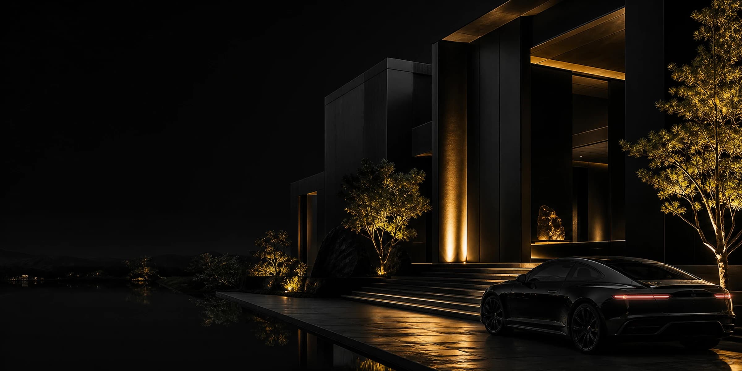 Matte-black modernist residence and grand tourer at night